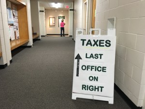 A corridor with a sign that reads, 