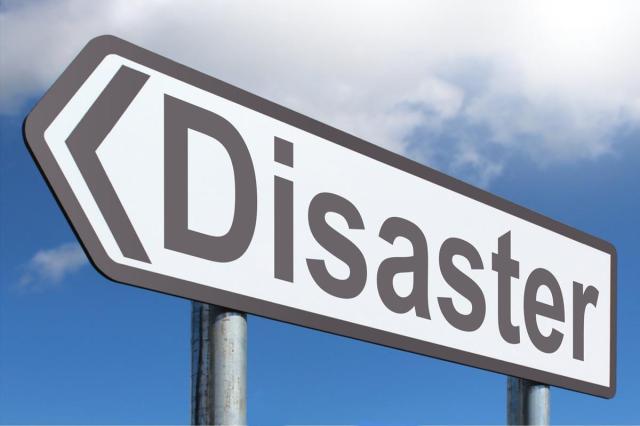 A road signpost containing the word Disaster.
