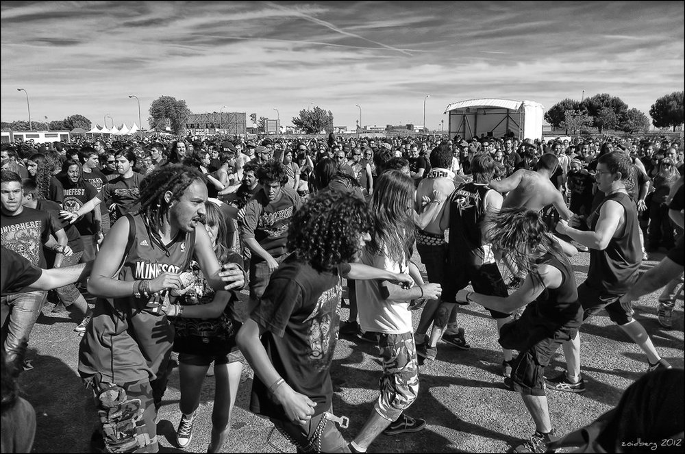 Heavy metal music fans dancing.