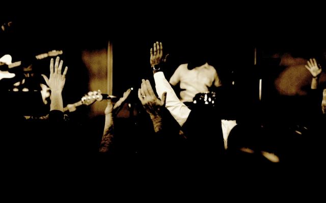 Hands raised in worship to God.