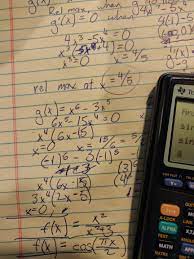 A calculator sits on a page of algebraic equations.
