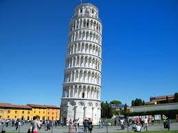 A photograph of the Leaning Tower of Pisa against a cloudless blue sky.