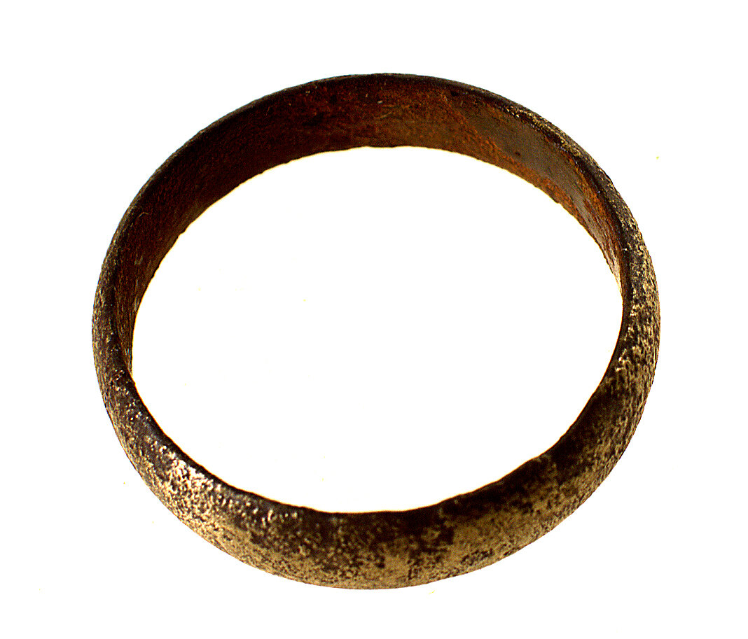 A tearnished gold ring.