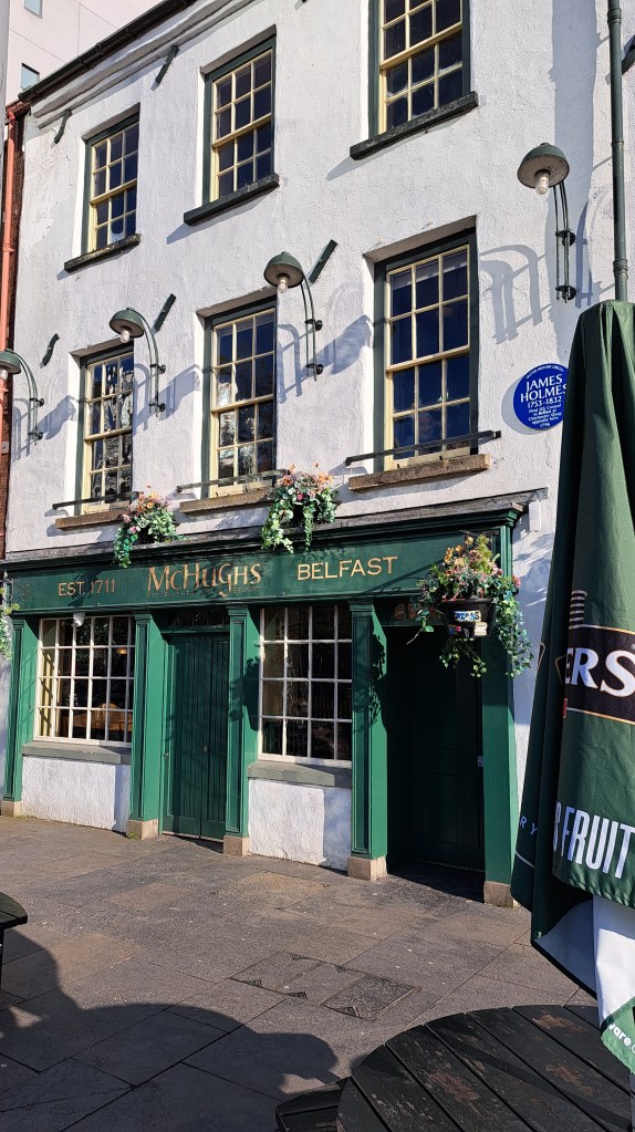 A Gallery of three photographs:
The Big Fish, showing the scales.
Detail of the Lagan Weir and the footbridge above.
The frontage of McHugh's Bar.