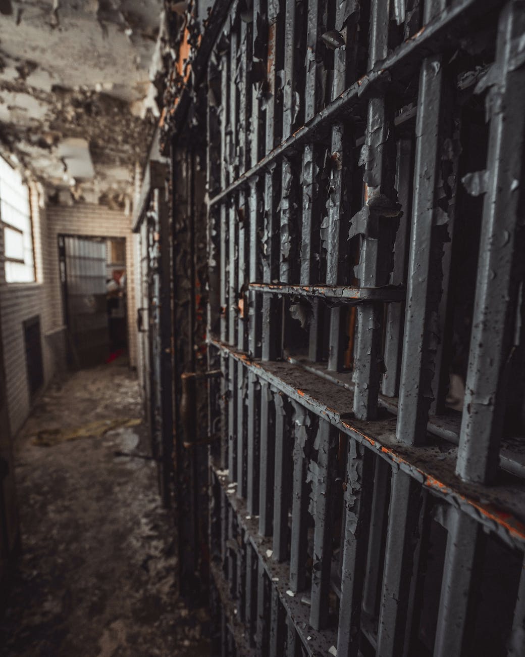 Metal bars on an old prison cell.