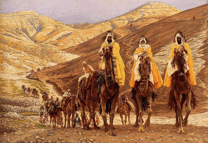 Three men in Arab dress, mounted on camels lead a caravan across a mountainous desert.