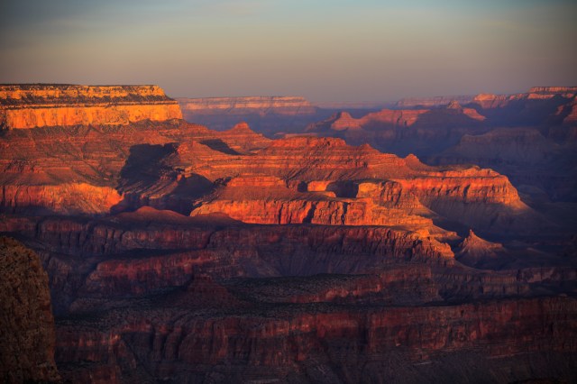 The pink light of dawn on the south rim of the Grand Canyon
