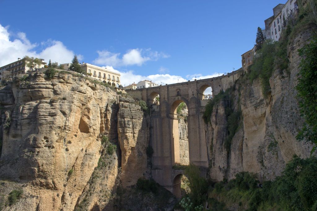 The Puente Nuevo (New Bridge) crossing the 120 m ravine at Rondo, Andalucia, Spain. Showing the Puente Viejo (Old Bridge) on which it is built